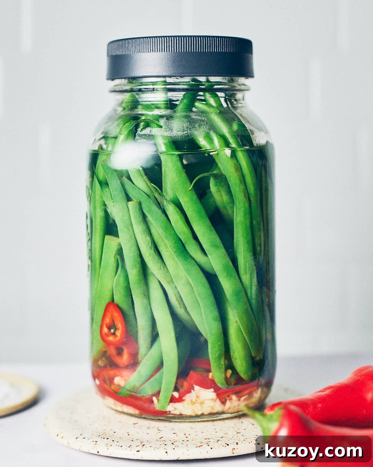 Assembled jar of quick pickled green beans before going into the refrigerator