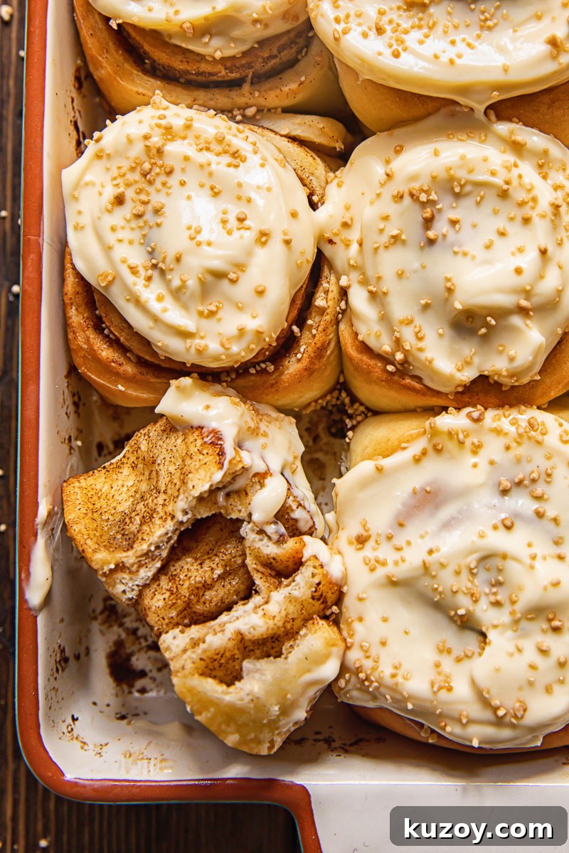 Maple Cream Cheese Cinnamon Rolls with Sticky Glaze 3 close up of sweet rolls in a pan