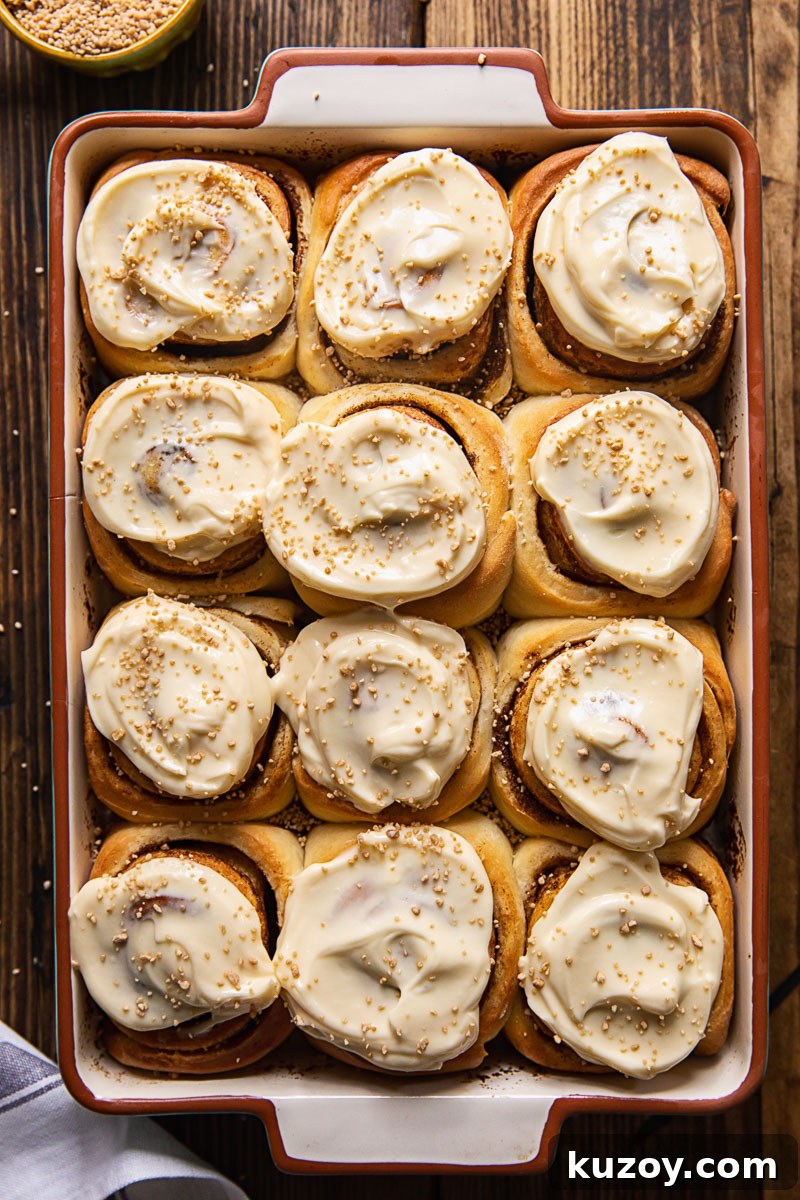 Maple Cream Cheese Cinnamon Rolls with Sticky Glaze 6 top down view of cinnamon rolls in a pan
