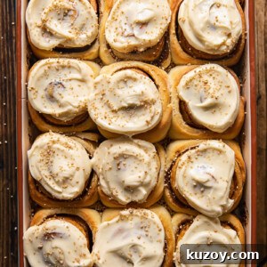 Maple Cream Cheese Cinnamon Rolls with Sticky Glaze 7 top down view of cinnamon rolls in a pan
