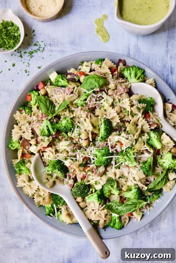 Close-up photo of Antipasto Pasta Broccoli Salad with Parmesan Herb Vinaigrette.