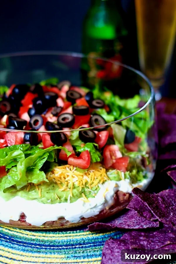 Seven Layer Dip in glass bowl.