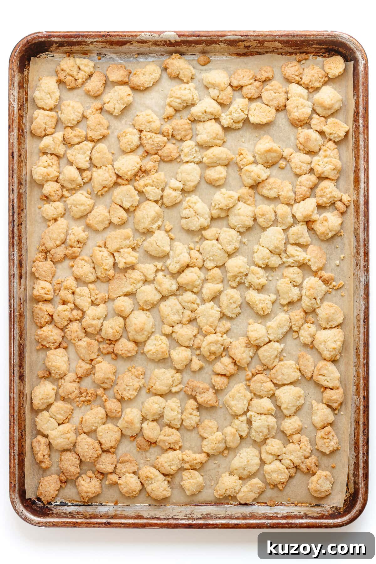 Baked streusel topping on a baking sheet.