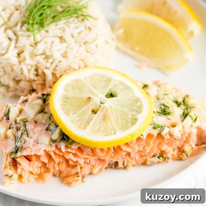14 Romantic Valentine’s Day Recipes to Make at Home 9 A piece of salmon served with rice and garnished with sliced lemons.