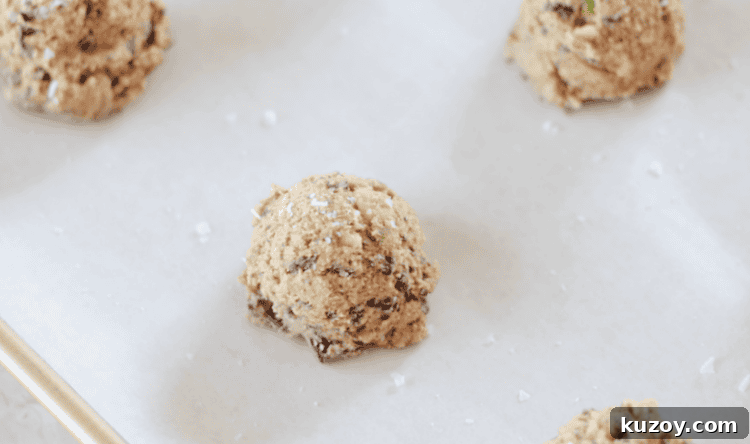 Disney Riviera Signature Cookies: Where to Find & Taste Them 8 cookie dough mounds on parchment lined baking sheet
