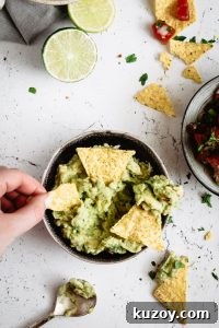 Guacamole served into a bowl with nachos