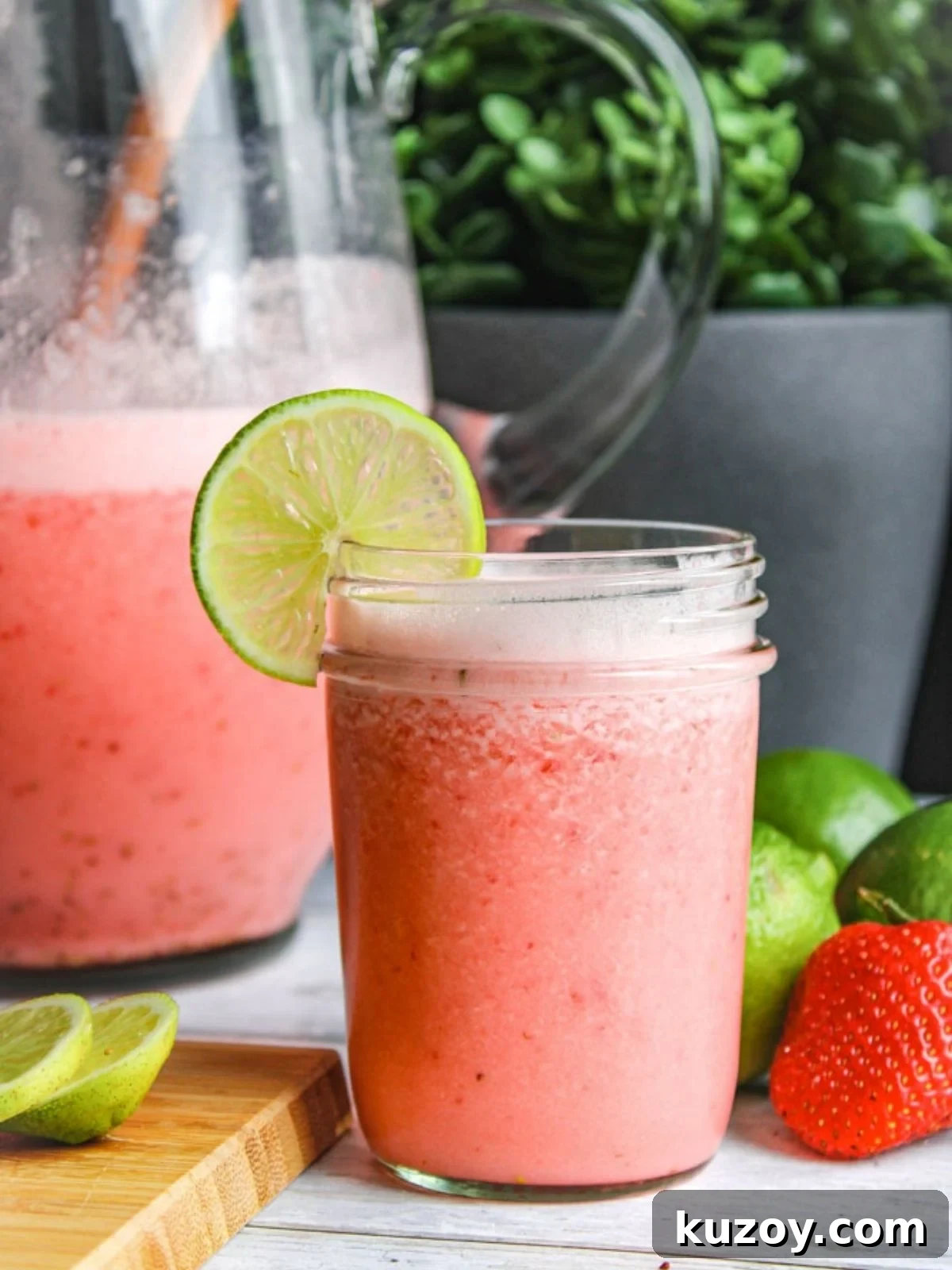 cup with Brazilian limeade with strawberries.