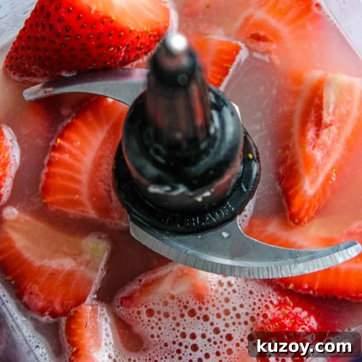 Blending strawberries in the lime juice.