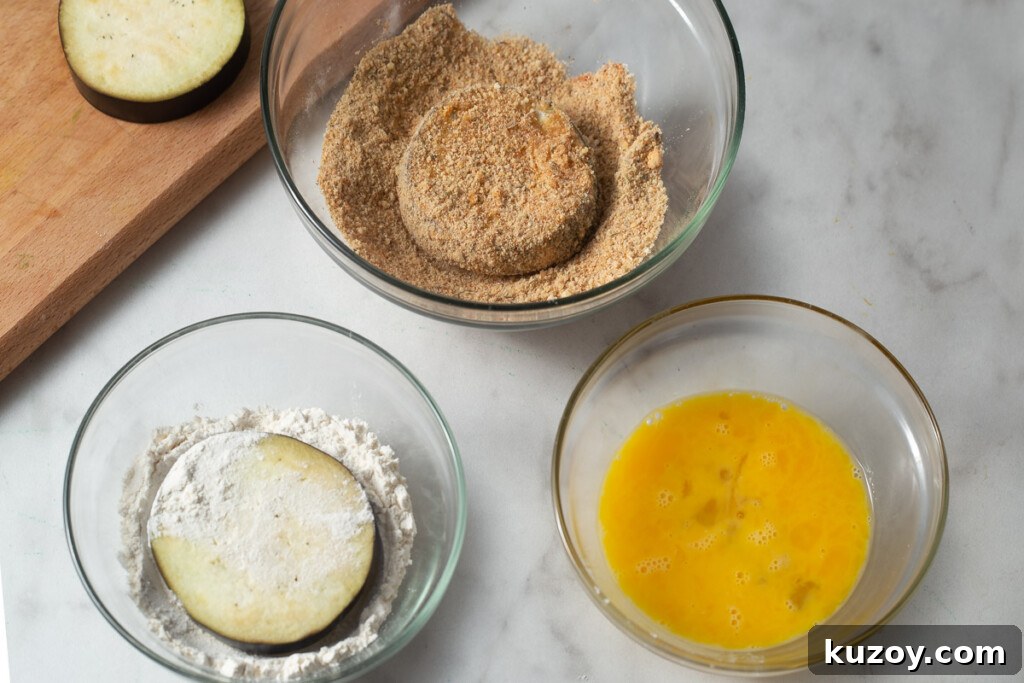 Crispy Air Fryer Eggplant Parmesan Recipe 9 eggplant dipped in seasoned breadcrumbs.