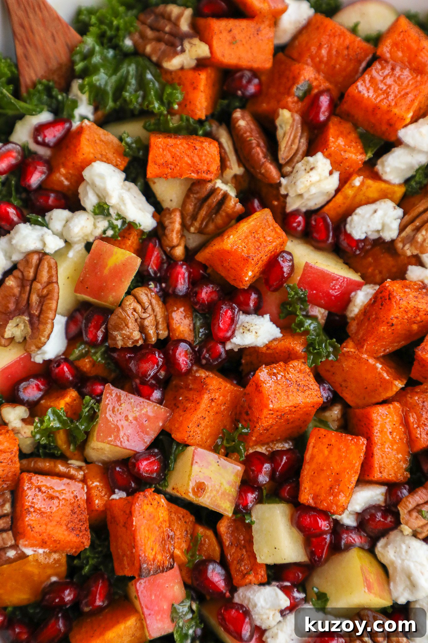 Cinnamon-Roasted Butternut Squash and Kale Salad Recipe 3 Cinnamon roasted butternut squash, crisp apples, juicy pomegranate arils, creamy goat cheese and tender kale are all tossed in a sweet apple cider vinaigrette and topped with toasted pecans! It's the perfect autumn side salad!