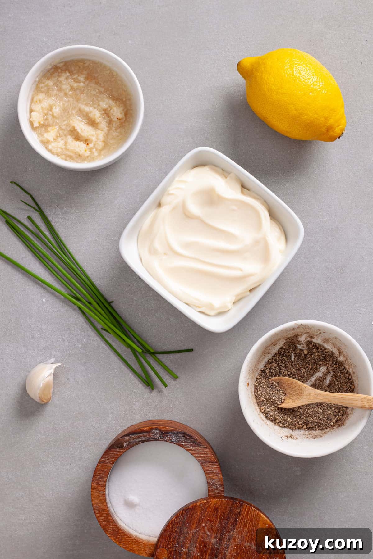 Ingredients for horseradish aioli on a gray table.