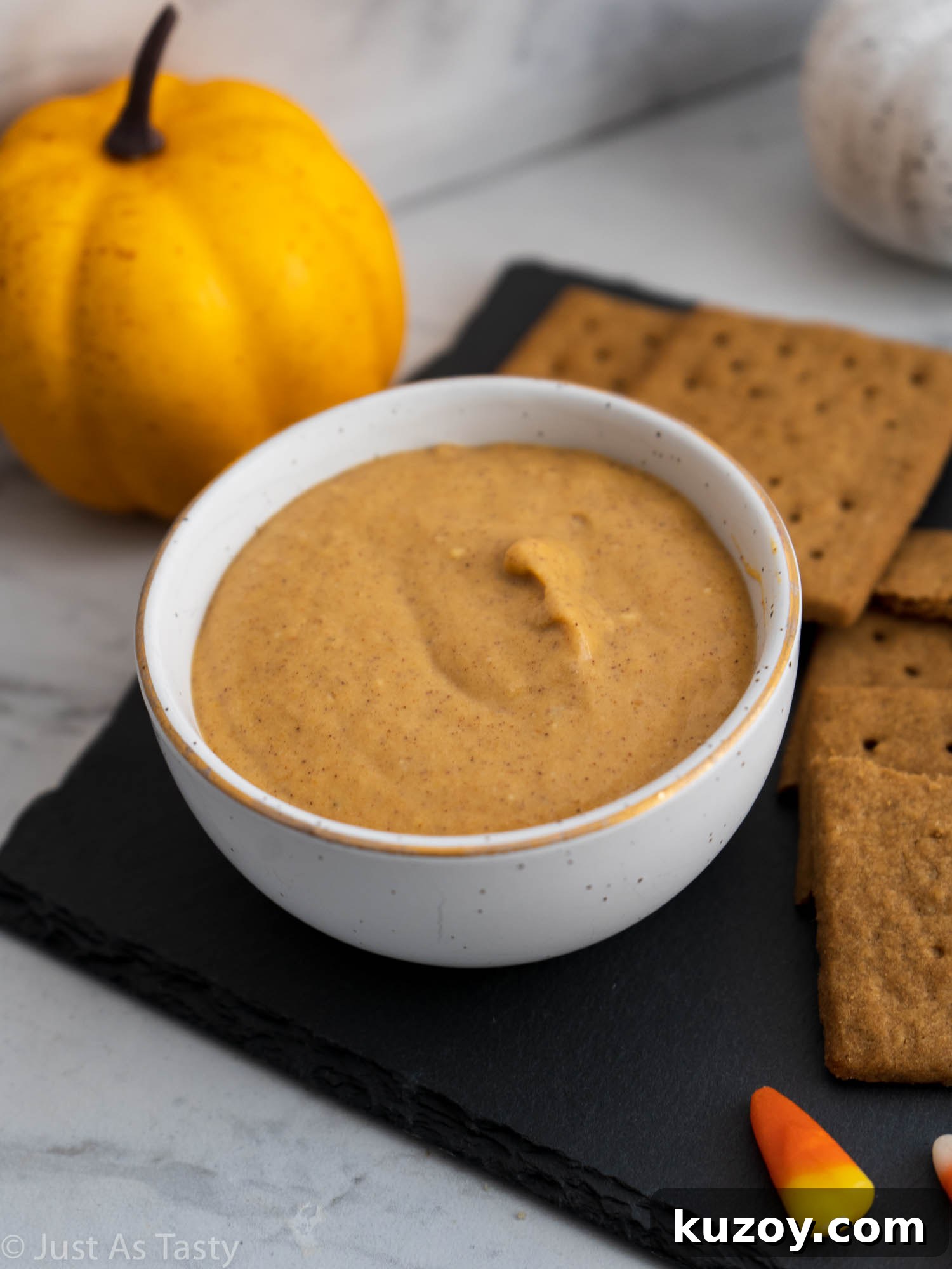 Creamy Pumpkin and Cream Cheese Dip Recipe for Fall Parties 2 Pumpkin cream cheese dip in a white bowl.