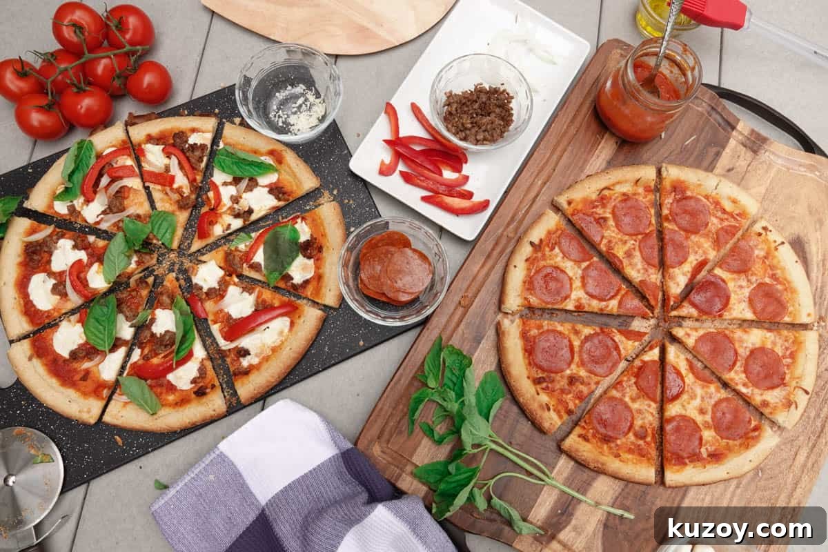 Smoked pizzas on table with tomatoes and ingredients in background