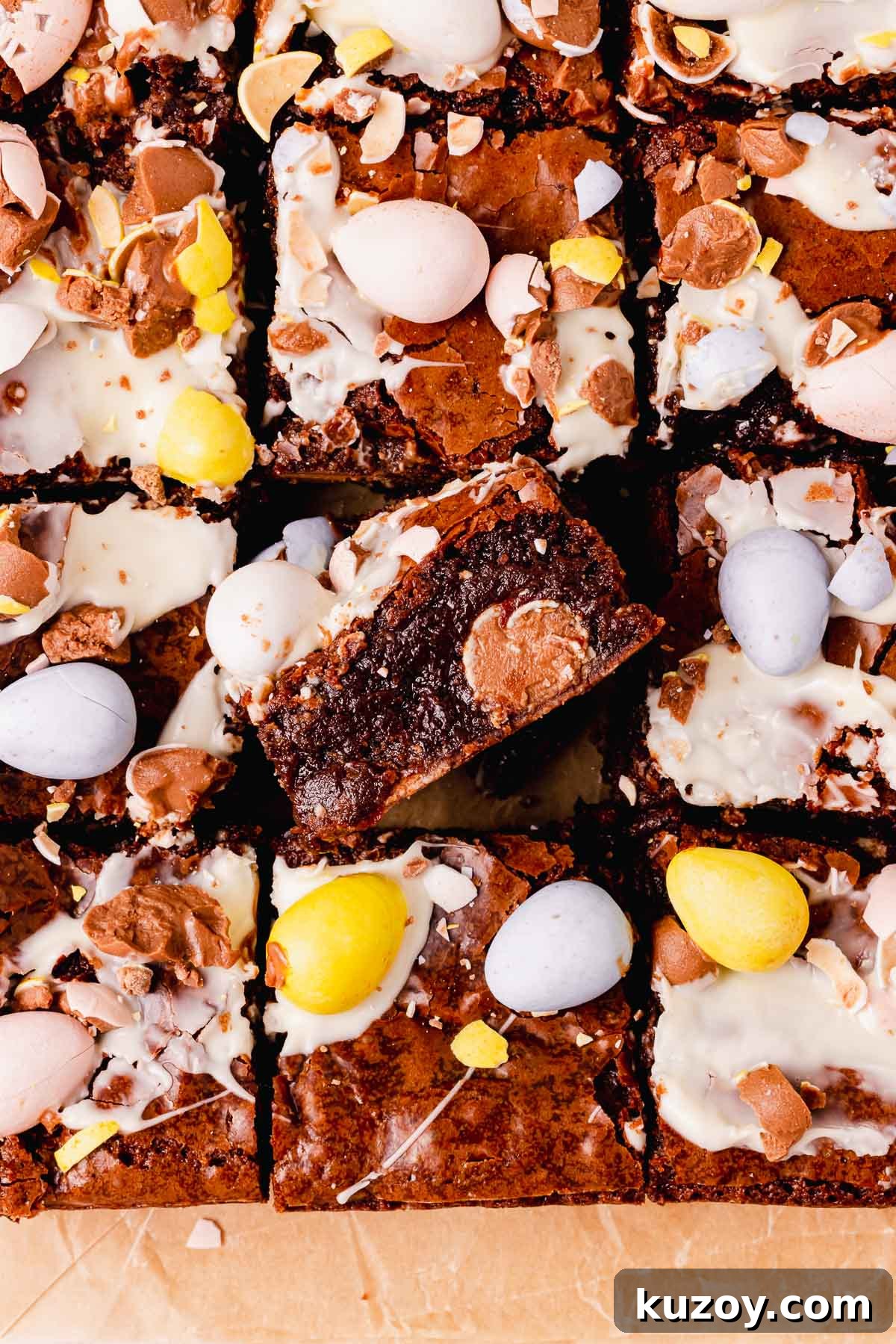Mini Egg Brownies Recipe for Rich, Fudgy Easter Treats 2 brownies topped and filled with mini eggs on parchment paper