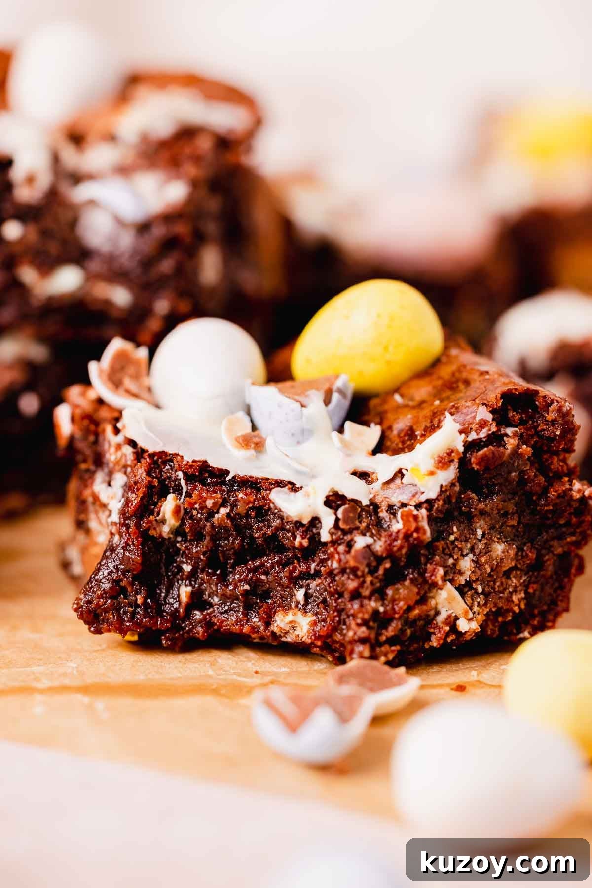 Mini Egg Brownies Recipe for Rich, Fudgy Easter Treats 14 bitten mini egg brownie square with mini eggs on top