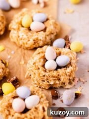 birds nest cookies on parchment paper with speckled mini eggs