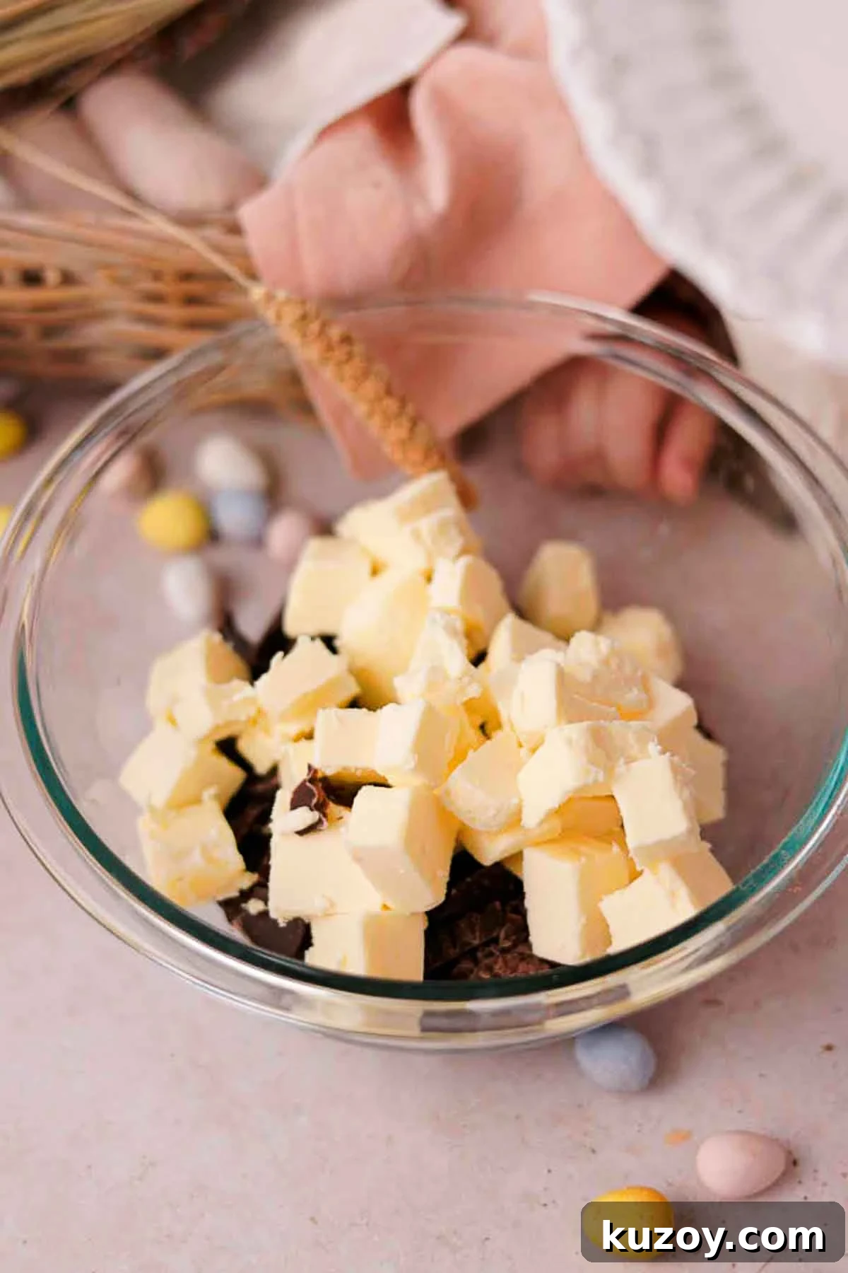 Mini Egg Brownies Recipe for Rich, Fudgy Easter Treats 5 combining cubed butter and chocolate in glass bowl