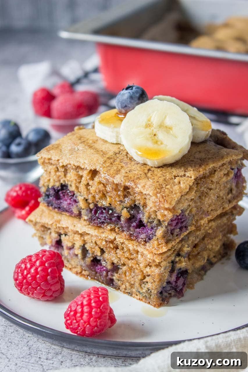 Blueberry Pancake Casserole Recipe: Baked Pancakes with Fresh Blueberries 2 Healthy oven baked Blueberry Pancake Casserole topped with banana and raspberries