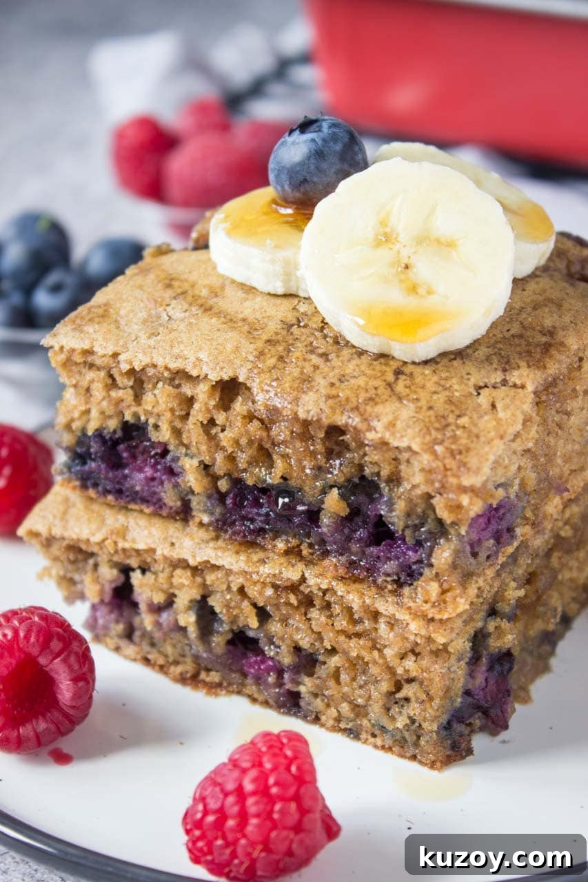 Blueberry Pancake Casserole Recipe: Baked Pancakes with Fresh Blueberries 3 Healthy oven baked Blueberry Pancake Casserole topped with banana and raspberries