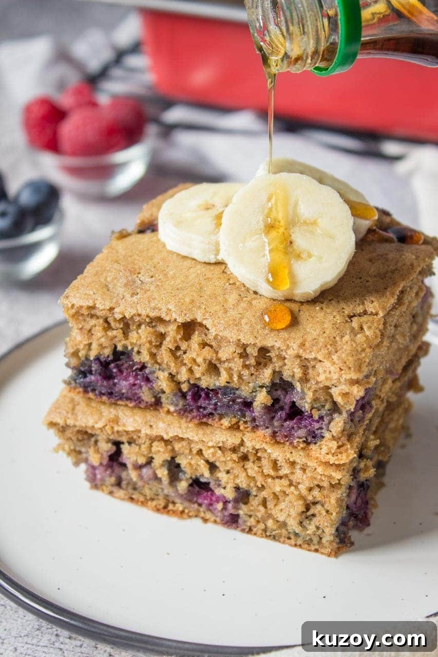 Blueberry Pancake Casserole Recipe: Baked Pancakes with Fresh Blueberries 5 Healthy oven baked Blueberry Pancake Casserole topped with banana and raspberries
