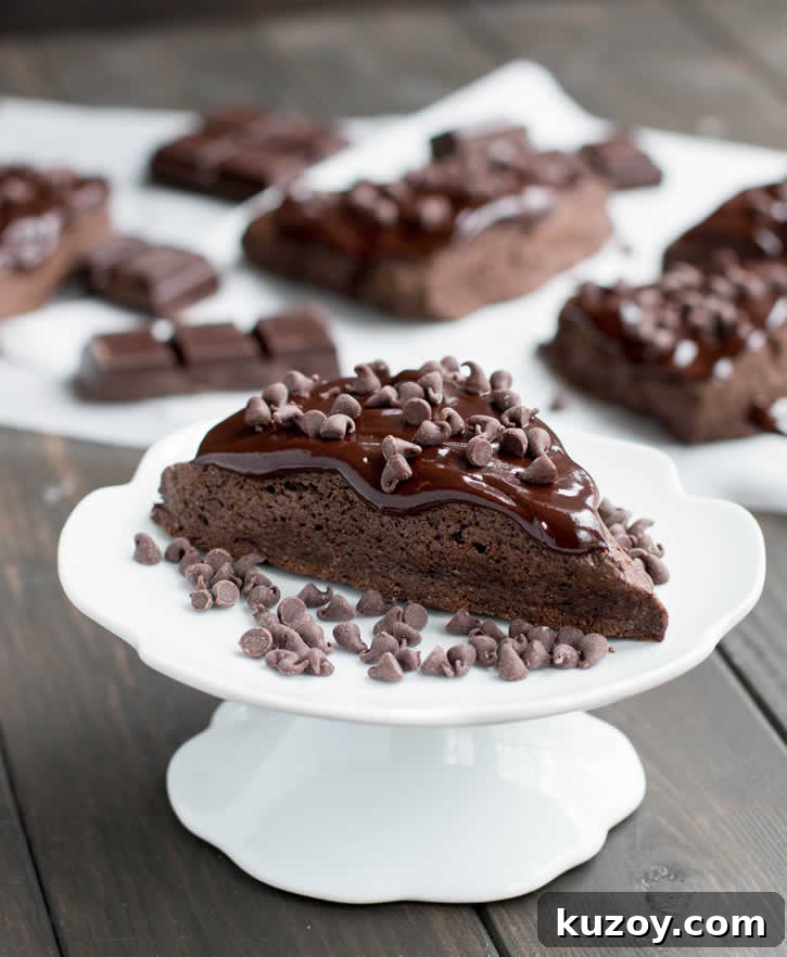 Decadent Dark Chocolate Fudge Scones — Recipe & Tips 2 Dark Chocolate Fudge Scones are lightly sweetened, yet rich with dark cocoa, butter and cream, then topped with a dark fudgy ganache and mini chips.