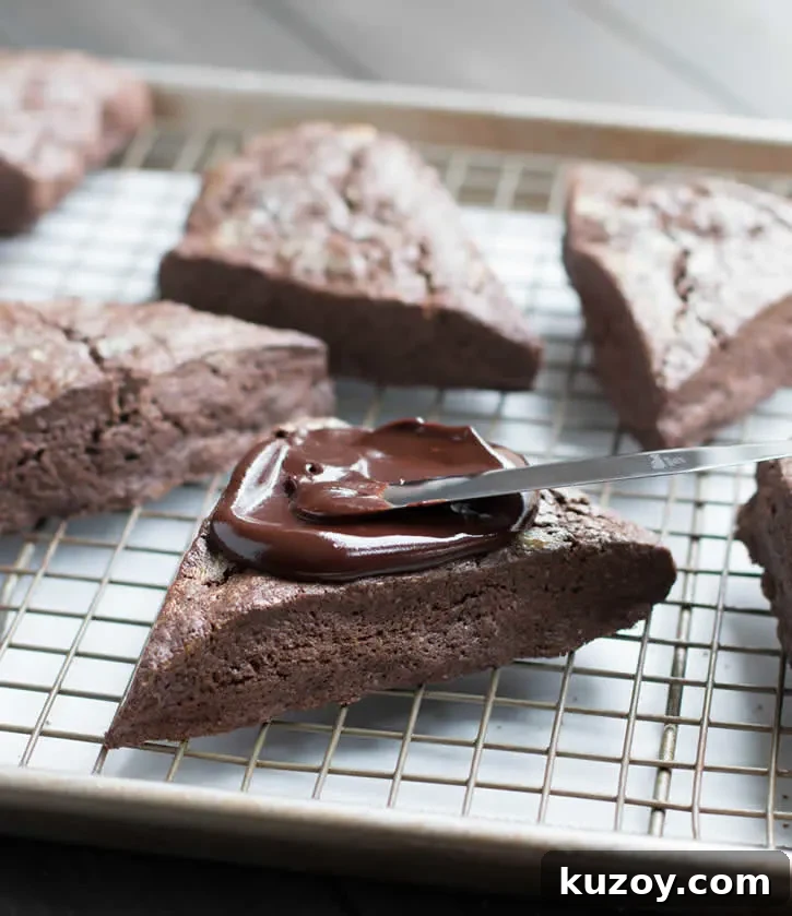 Decadent Dark Chocolate Fudge Scones — Recipe & Tips 6 Dark Chocolate Fudge Scones are lightly sweetened, yet rich with dark cocoa, butter and cream, then topped with a dark fudgy ganache and mini chips.