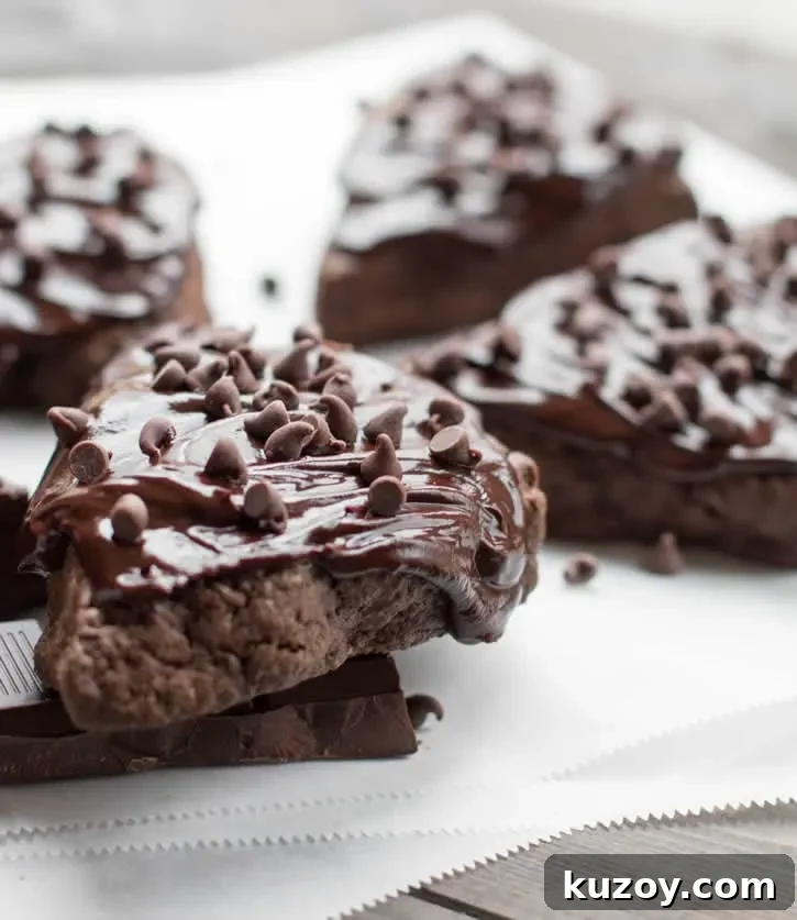 Decadent Dark Chocolate Fudge Scones — Recipe & Tips 11 Dark Chocolate Fudge Scones are lightly sweetened, yet rich with dark cocoa, butter and cream, then topped with a dark fudgy ganache and mini chips.