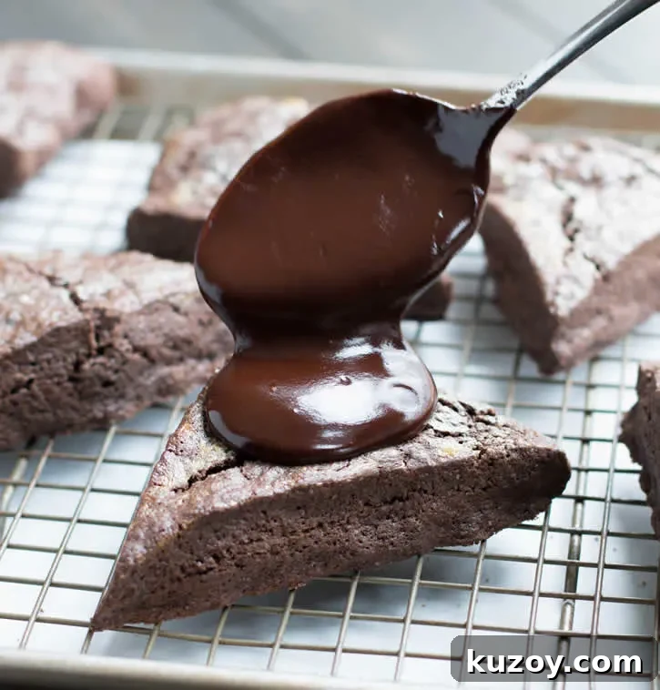 Decadent Dark Chocolate Fudge Scones — Recipe & Tips 5 Dark Chocolate Fudge Scones are lightly sweetened, yet rich with dark cocoa, butter and cream, then topped with a dark fudgy ganache and mini chips.