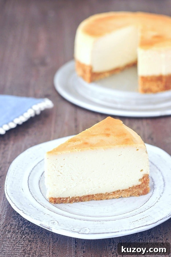 Vegan NY Cheesecake @spabettie one slice of plain vegan cheesecake on a plate, before adding toppings, full cheesecake in background