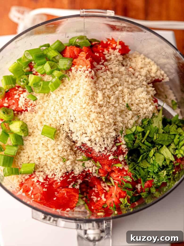 Ingredients for salmon patties in a food processor.