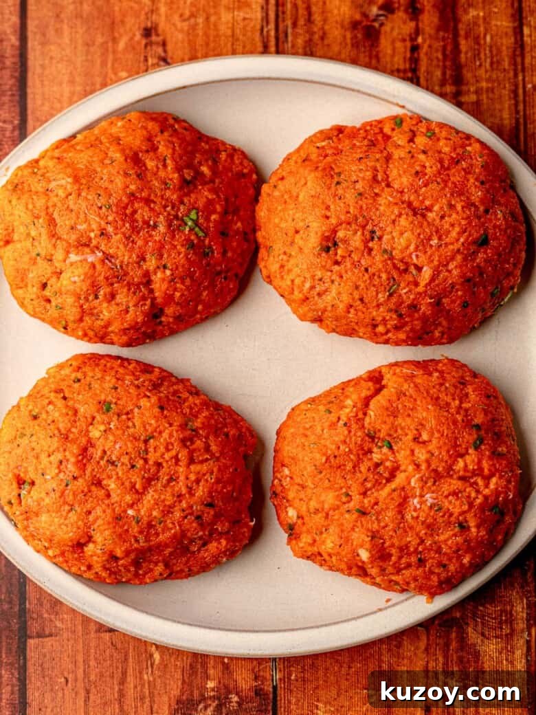 Salmon patties on a plate.