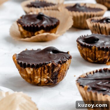 Completed No-Bake Peanut Butter Cups on a white surface.