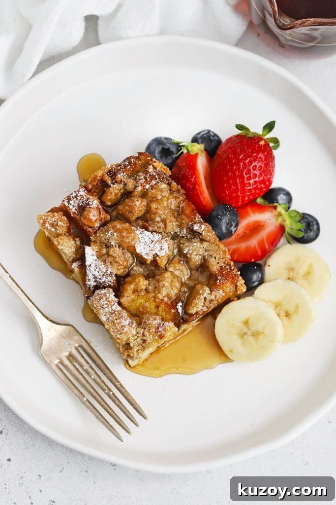 Gluten-Free Eggnog French Toast Casserole Recipe for Holidays 13 Slice of gluten-free eggnog french toast casserole topped with powdered sugar and maple syrup
