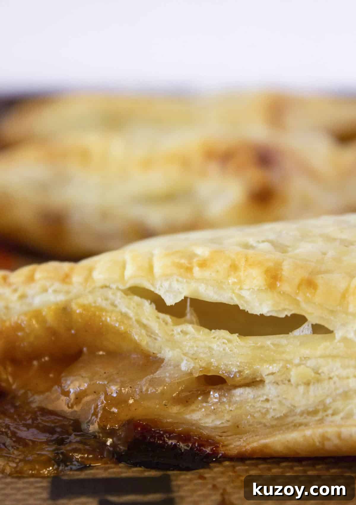 Caramel Apple Turnovers Recipe: Flaky Pastry with Gooey Filling 7 Baking the turnovers until they are golden brown.