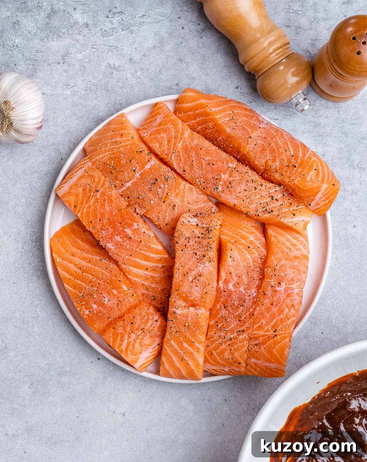 Raw salmon filets on a plate.