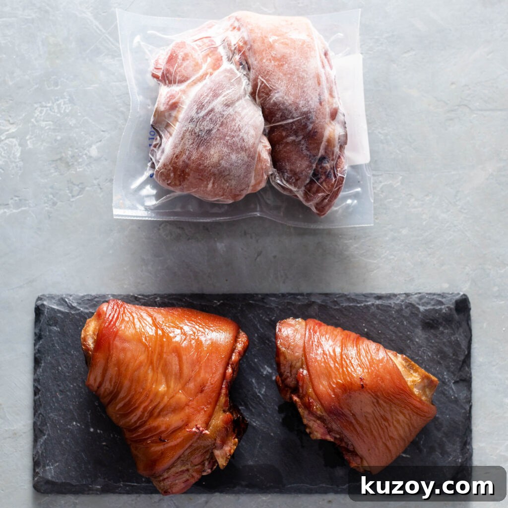 How to Cook Smoked Ham Hocks: Flavorful Recipes & Tips 3 smoked ham hocks on black plate and two vacuum sealed smoked ham hocks