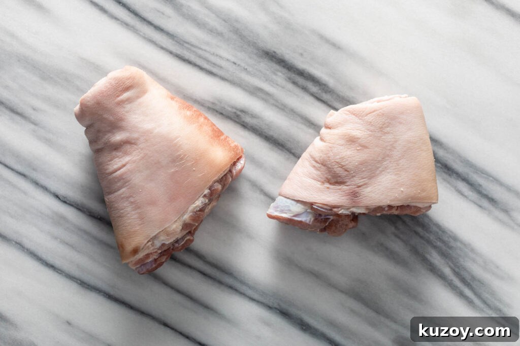 How to Cook Smoked Ham Hocks: Flavorful Recipes & Tips 4 two ham hocks on a marble slab