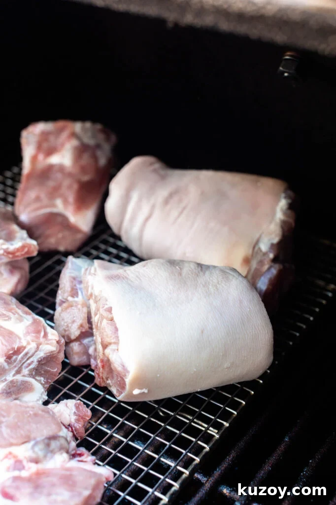 How to Cook Smoked Ham Hocks: Flavorful Recipes & Tips 5 ham hocks on a wire rack in the smoker