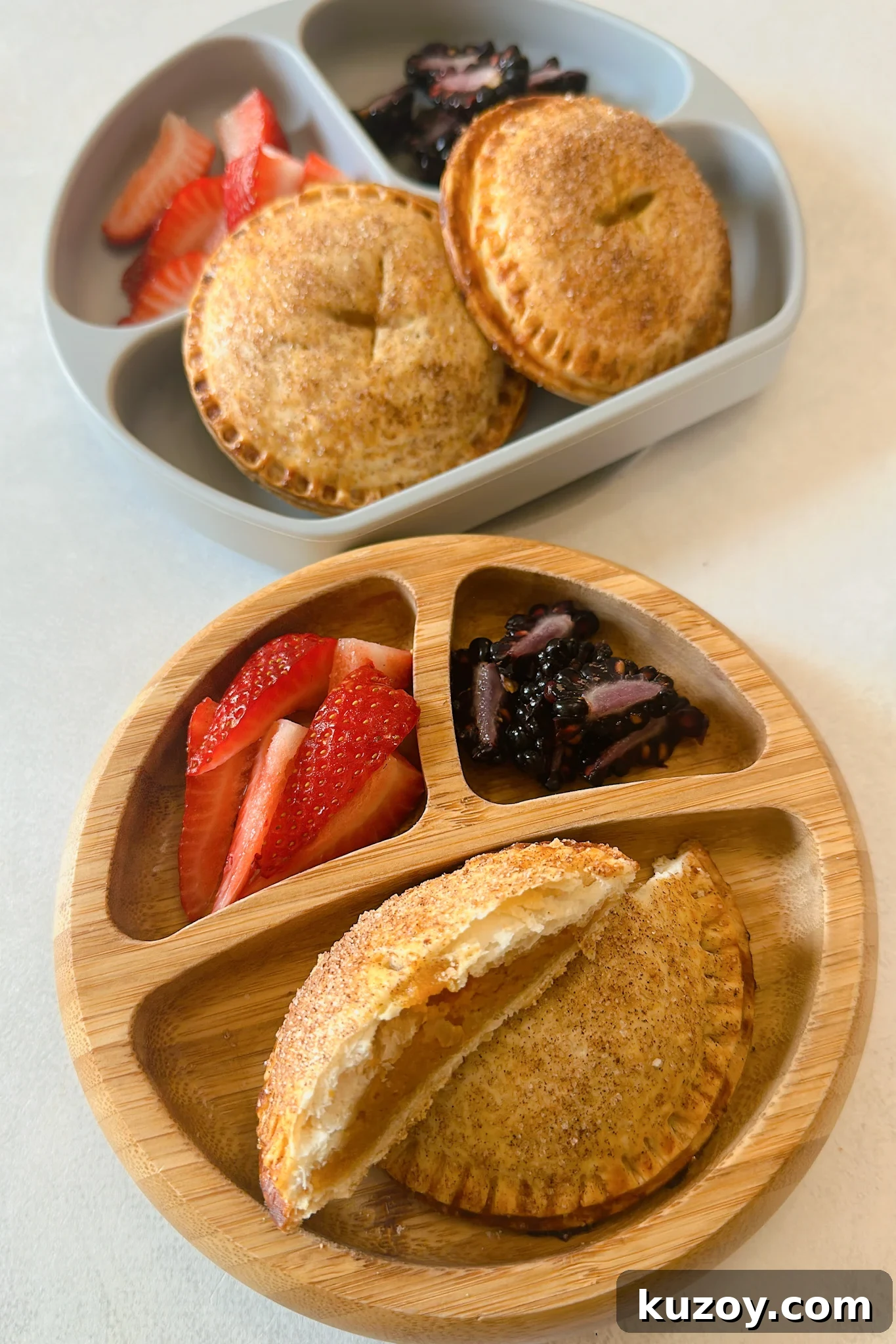 Sweet Potato Hand Pies Recipe: Flaky Crust & Savory-Sweet Filling 7 Sweet potato hand pies served with strawberries and blackberries.