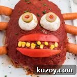 Spooky Monster Meatloaf Recipe for Halloween Dinner 7 Close up featured image of a monster meatloaf.