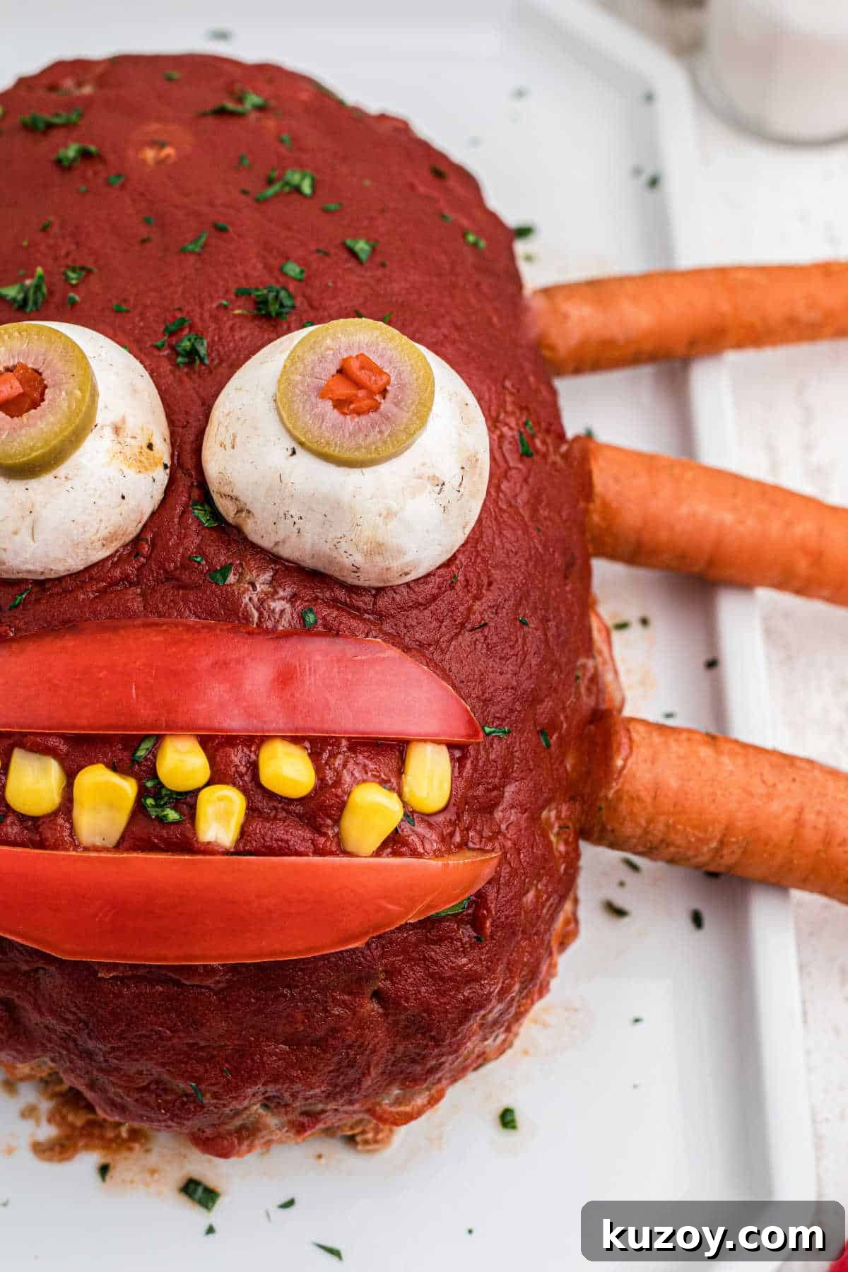 Spooky Monster Meatloaf Recipe for Halloween Dinner 4 Close up side view of a monster meatloaf.