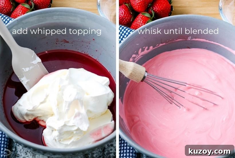 Two photo collage showing Cool Whip being added to the strawberry gelatin mixture and mixing it in with text overlay.