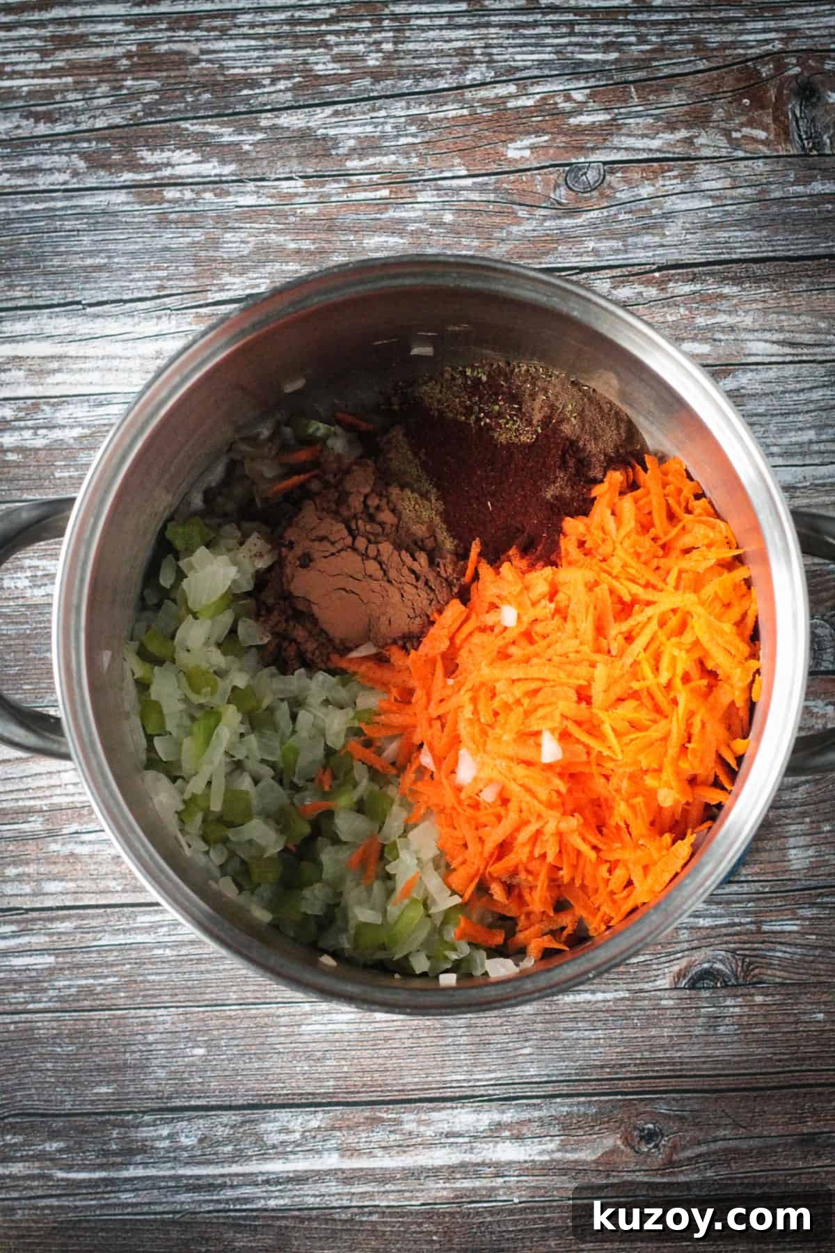 Hearty Black Bean and Quinoa Chili Recipe 3 Adding spices and shredded carrots to the pot.