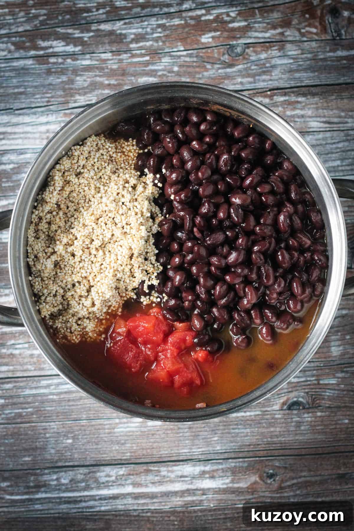 Hearty Black Bean and Quinoa Chili Recipe 5 Beans, quinoa, and diced tomatoes added to the pot.