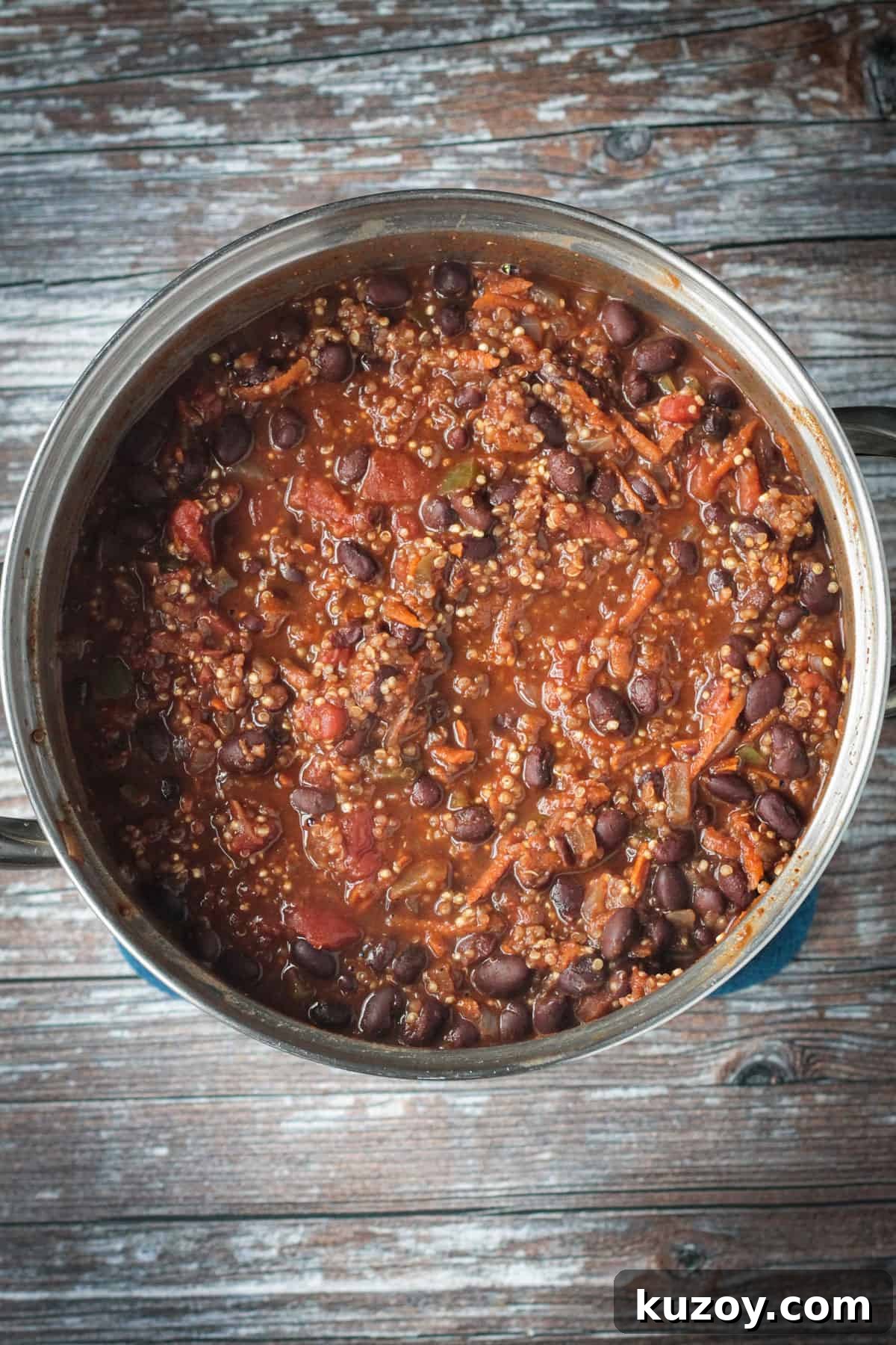 Hearty Black Bean and Quinoa Chili Recipe 7 A pot of black bean quinoa chili after simmering on the stove.