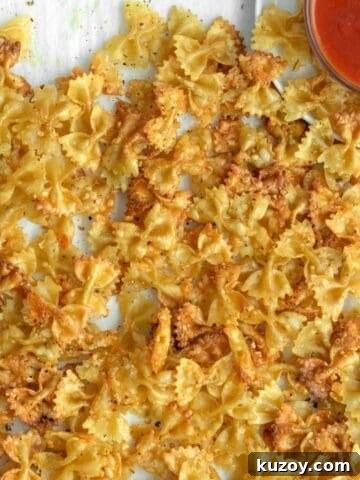 baked pasta chips with marinara sauce.