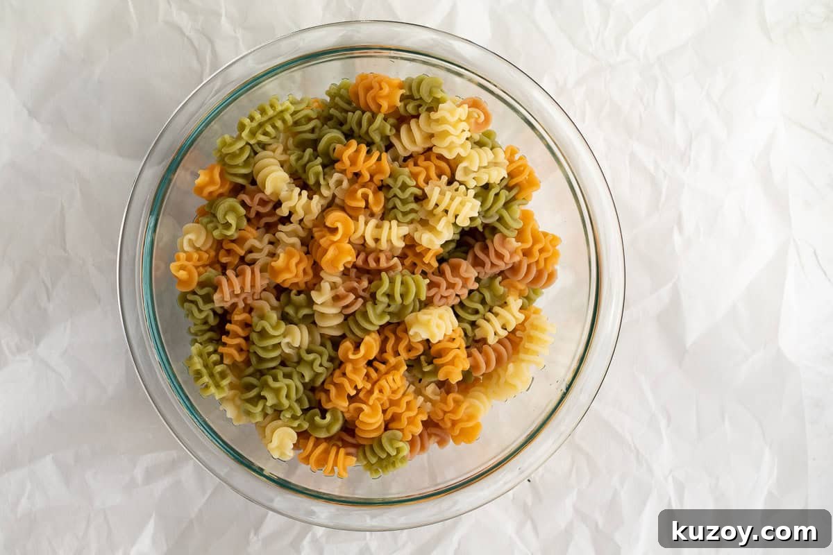 Zesty Italian Pasta Salad with 6 Simple Ingredients 4 cooked pasta in a bowl