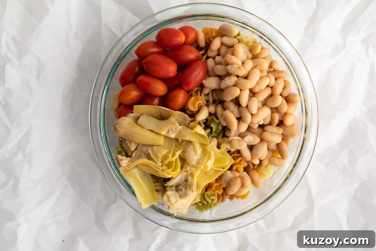 Zesty Italian Pasta Salad with 6 Simple Ingredients 5 pasta salad ingredients in glass bowl
