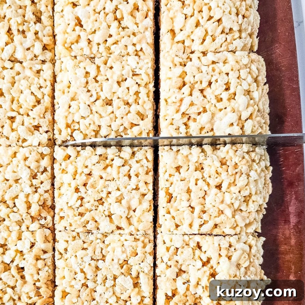 Blue Candy-Coated Rice Krispies Pops: Fun Party Treats 8 Cutting Rice Krispies into rectangles