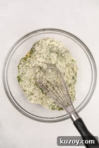 Homemade Ranch Seasoning Mix Recipe for Dips & Dressings 13 Whisking together herbs and buttermilk powder in a bowl.